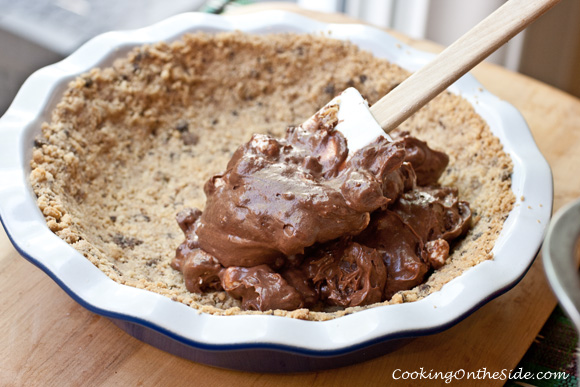 Filling the shortbread crust with rocky road brownie pudding