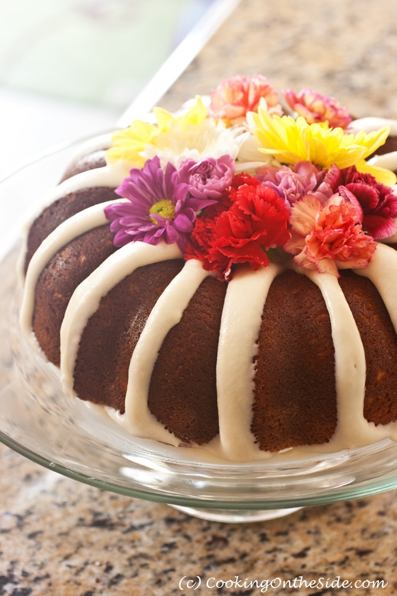 decorating a bundt cake with flowers